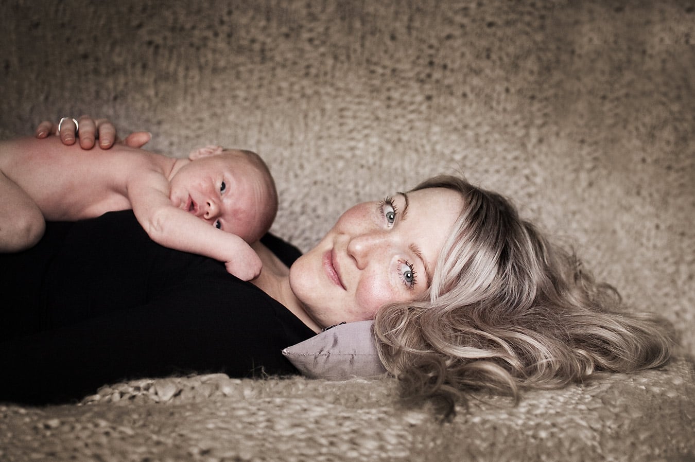 a newborn baby with mother from a photoshoot in Warwickshire
